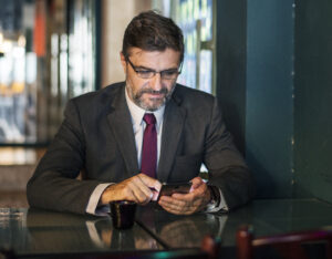 Man checking text messages that may be used as court evidence.